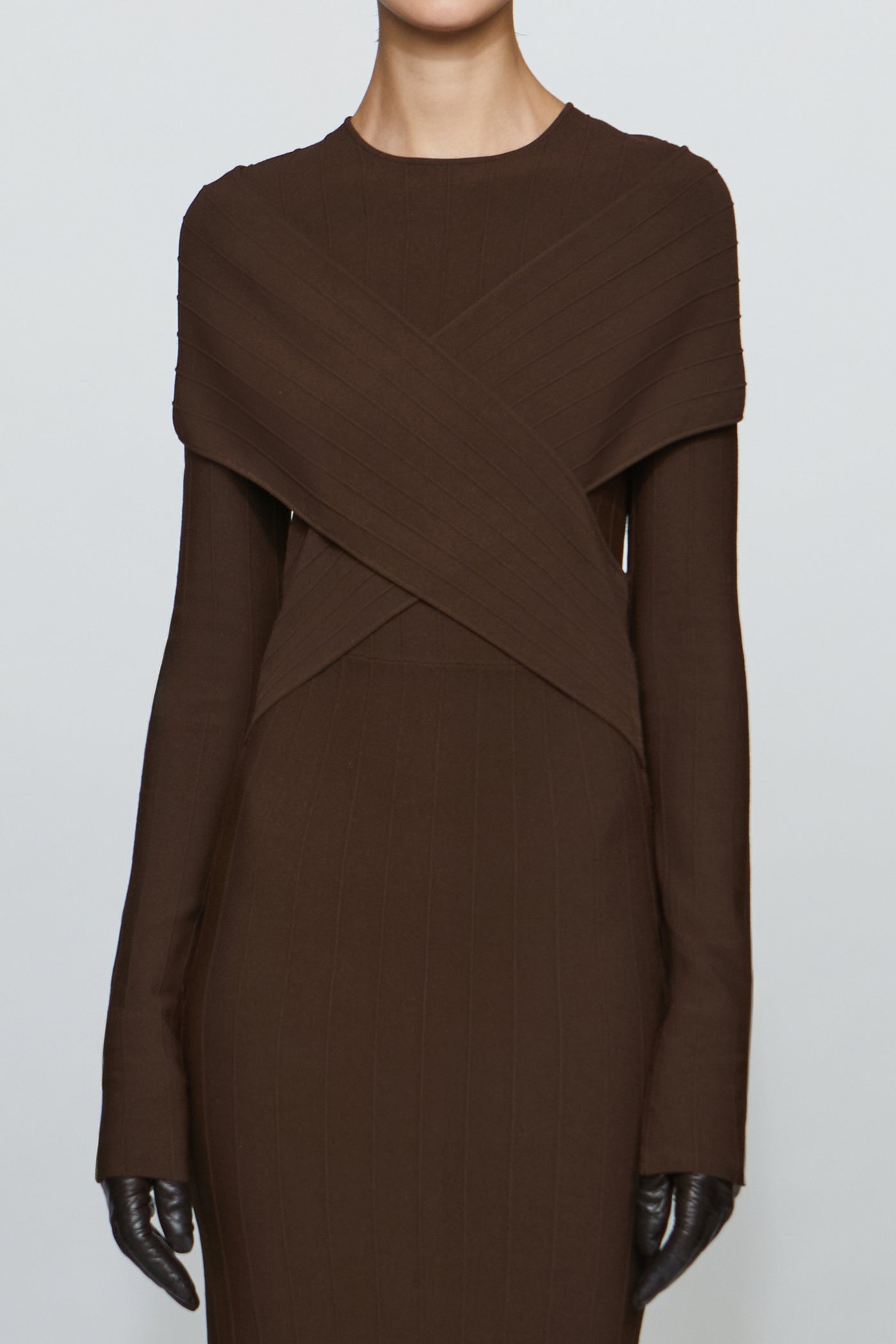 Brown dress with a unique design on a white background